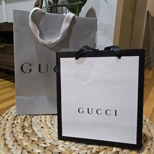 2 Gucci shopping bags